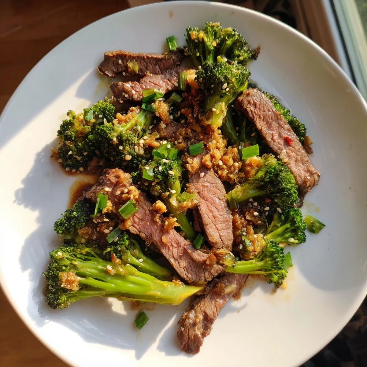 Steaming Keto Friendly Beef and Broccoli Stir Fry, the savory beef and crisp broccoli are coated in a flavorful glaze.