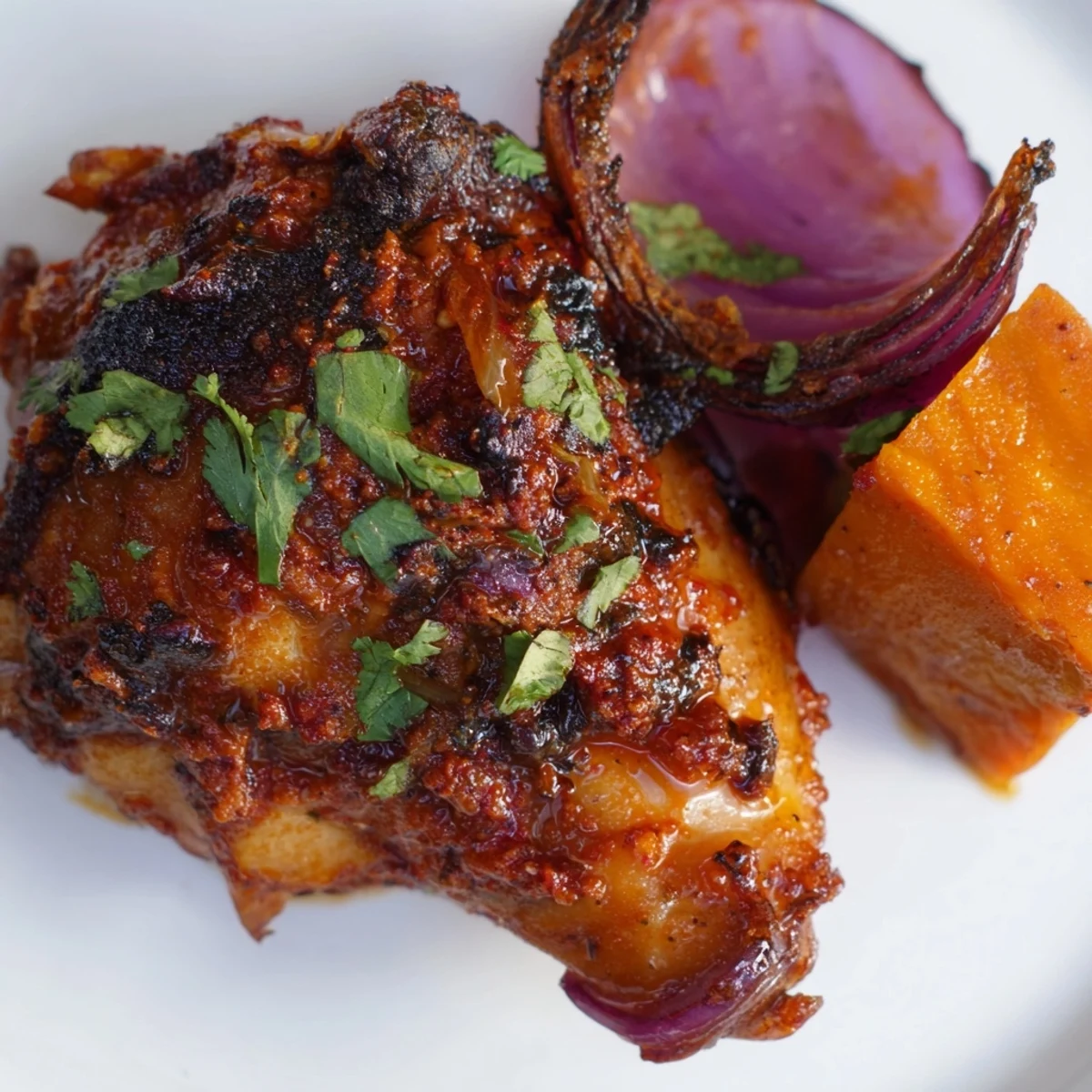 Sheet Pan Harissa Chicken with Sweet Potatoes roasted with golden, crisp skin on a single pan for easy cleanup.