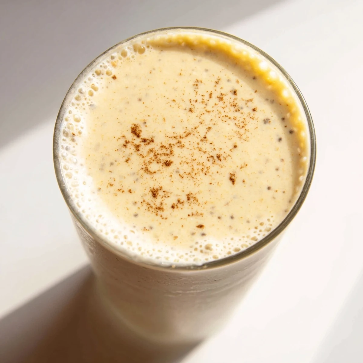Thick and velvety Greek yogurt banana smoothie blending ripe frozen bananas with protein-rich yogurt for breakfast