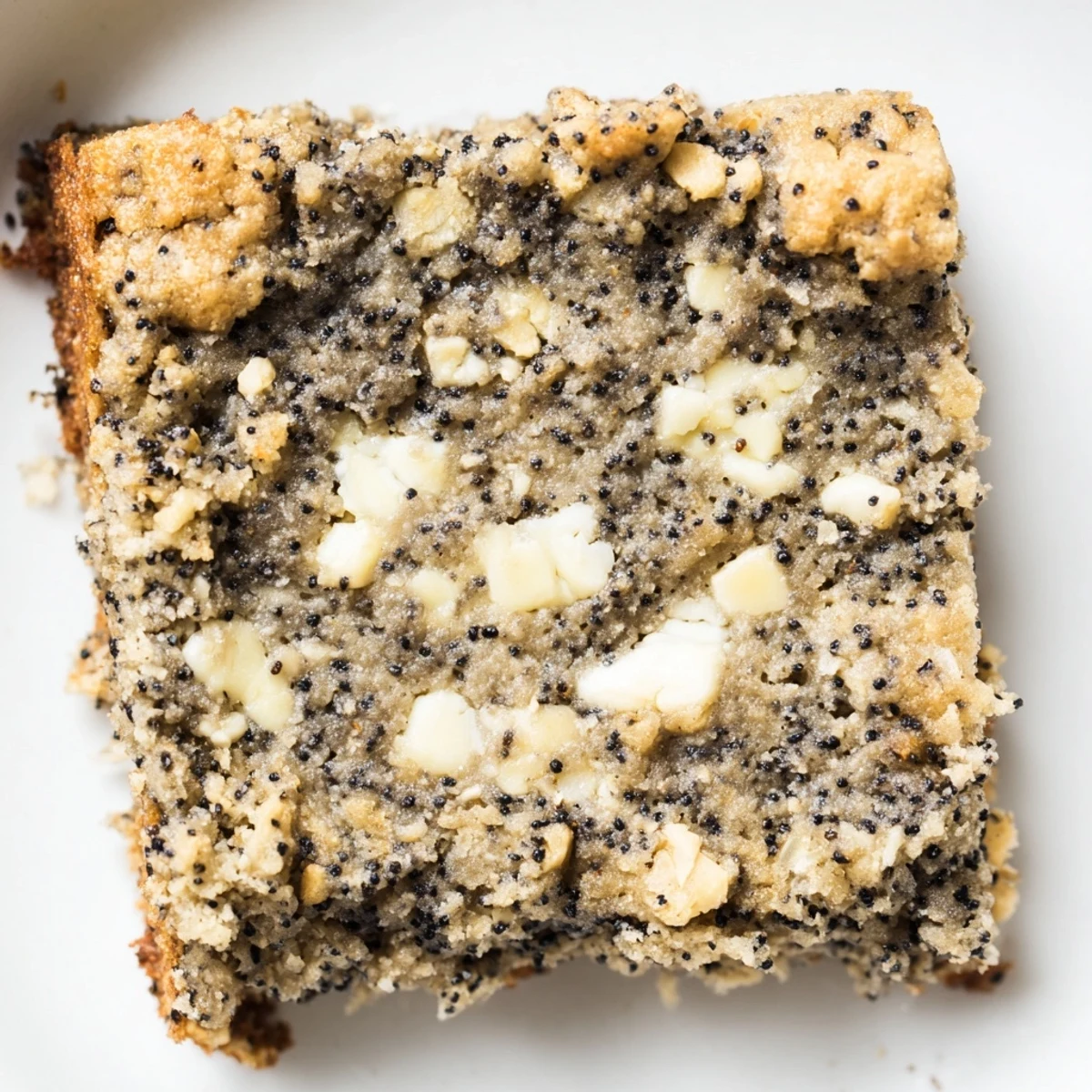 Golden squares of black sesame blondies with nutty swirls and crumbly texture ready to serve