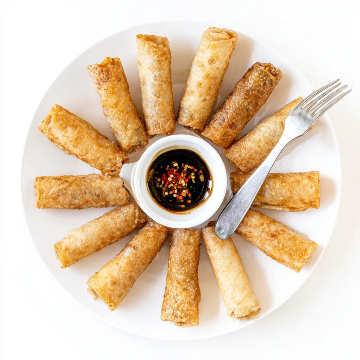 Baked rice paper spring rolls featuring a savory vegetable protein mix served with dipping sauce