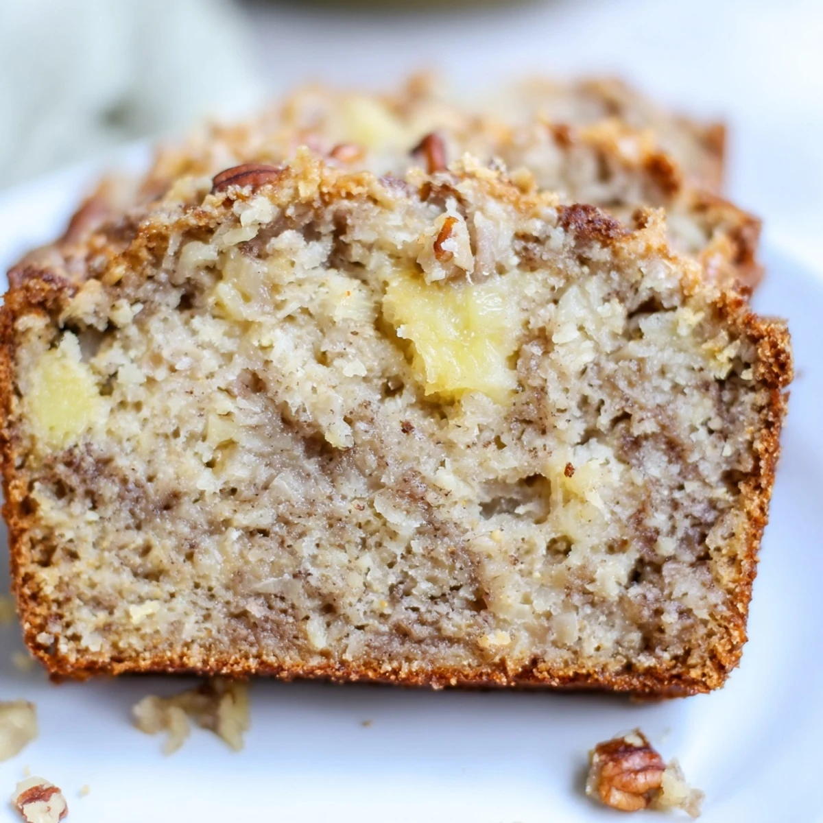 Freshly baked tropical coconut pineapple banana bread cooling on a wire rack, ready for breakfast or snacking