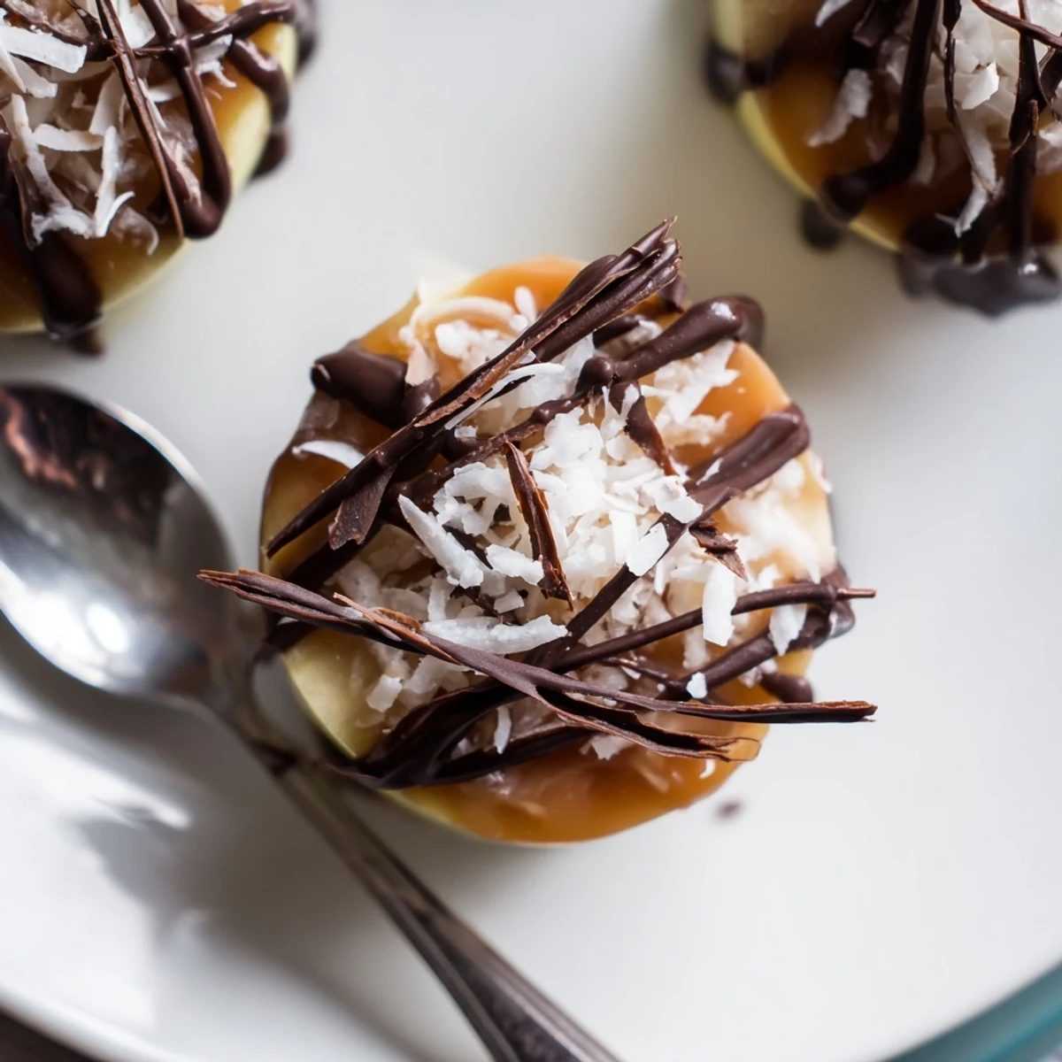 Drizzled chocolate and sea salt flecks atop Samoa Apple Slices ready to serve  