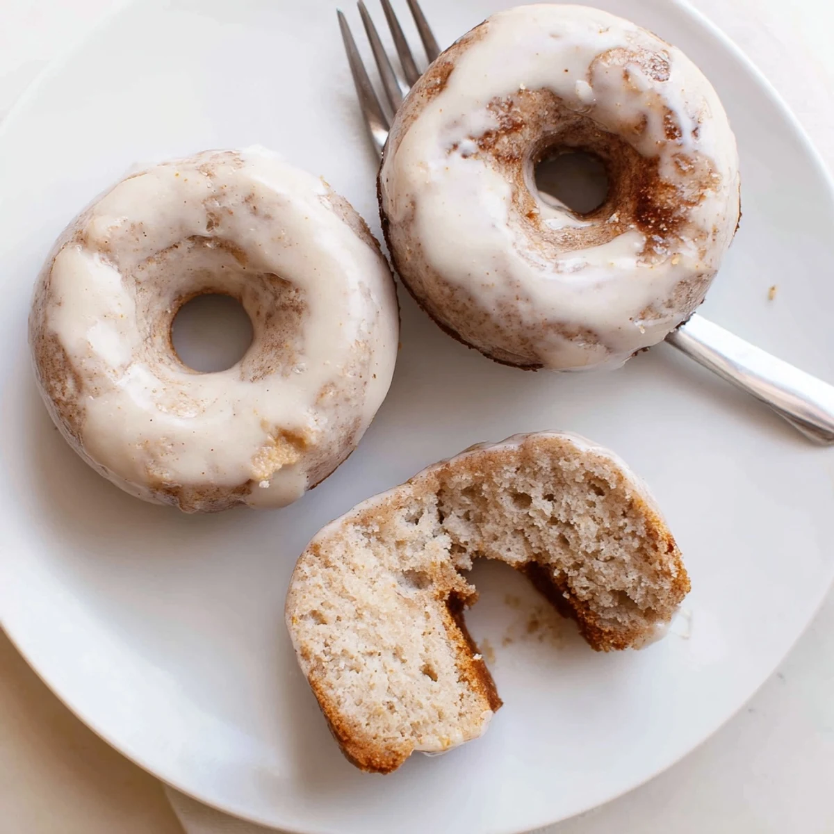 Banana Donuts cooling on wire rack, golden edges, sweet banana aroma