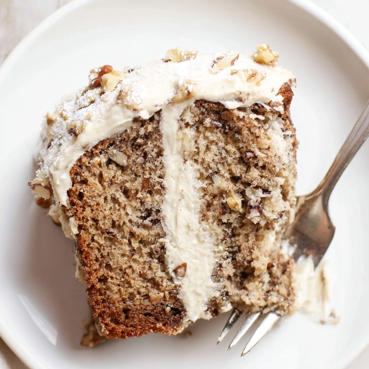 Sliced Banana Bread Cake Recipe served with vanilla ice cream, cinnamon aroma.