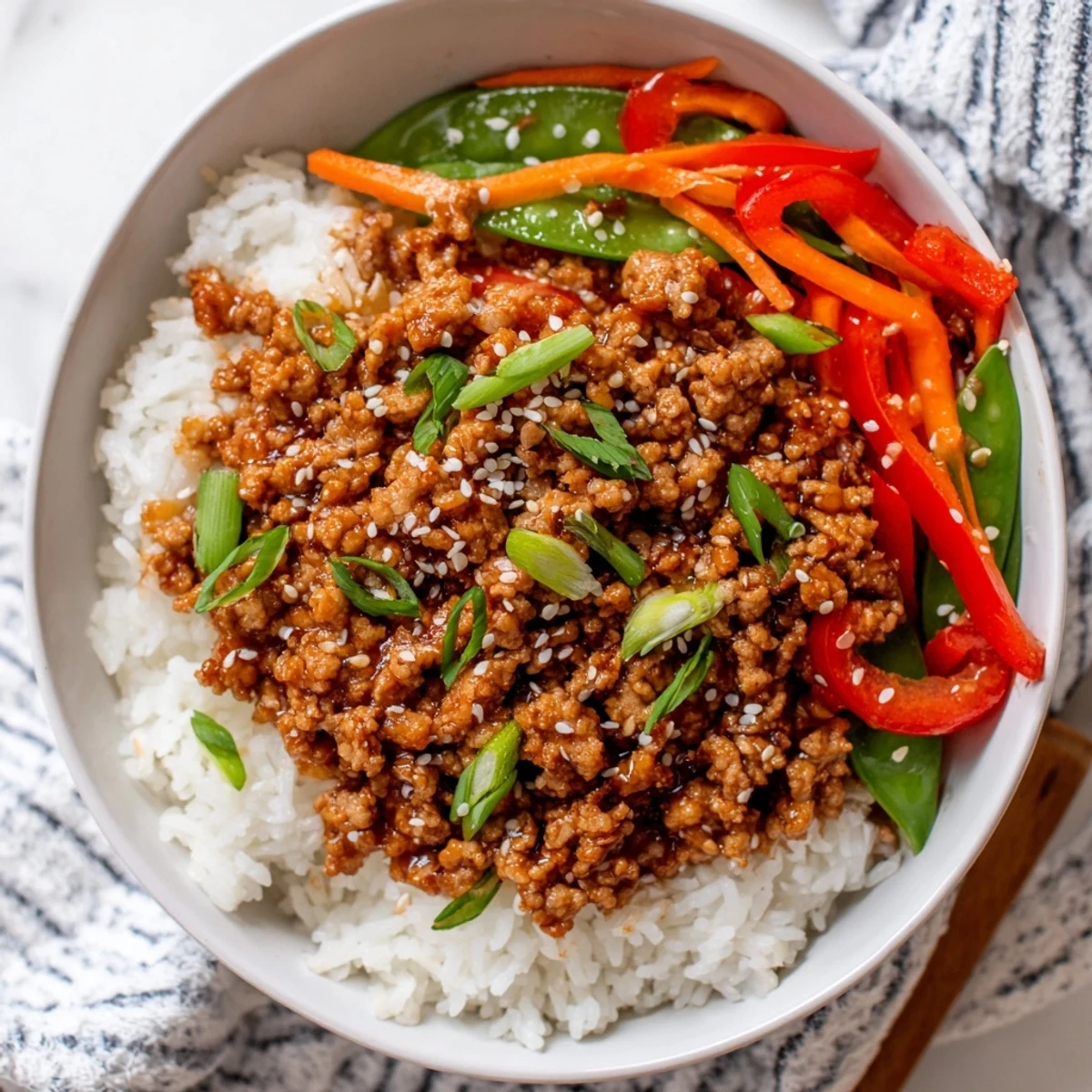 Teriyaki Turkey Rice Bowls steaming with glossy sauce, fluffy rice, crisp veggies