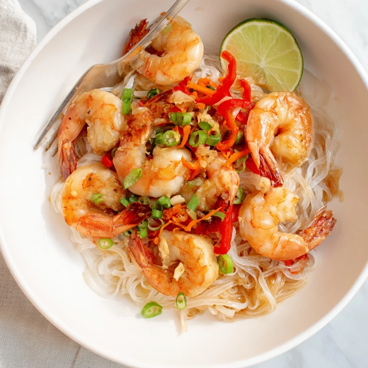 Spicy Garlic Shrimp Noodles Recipe: glossy noodles tossed with sizzling garlic shrimp